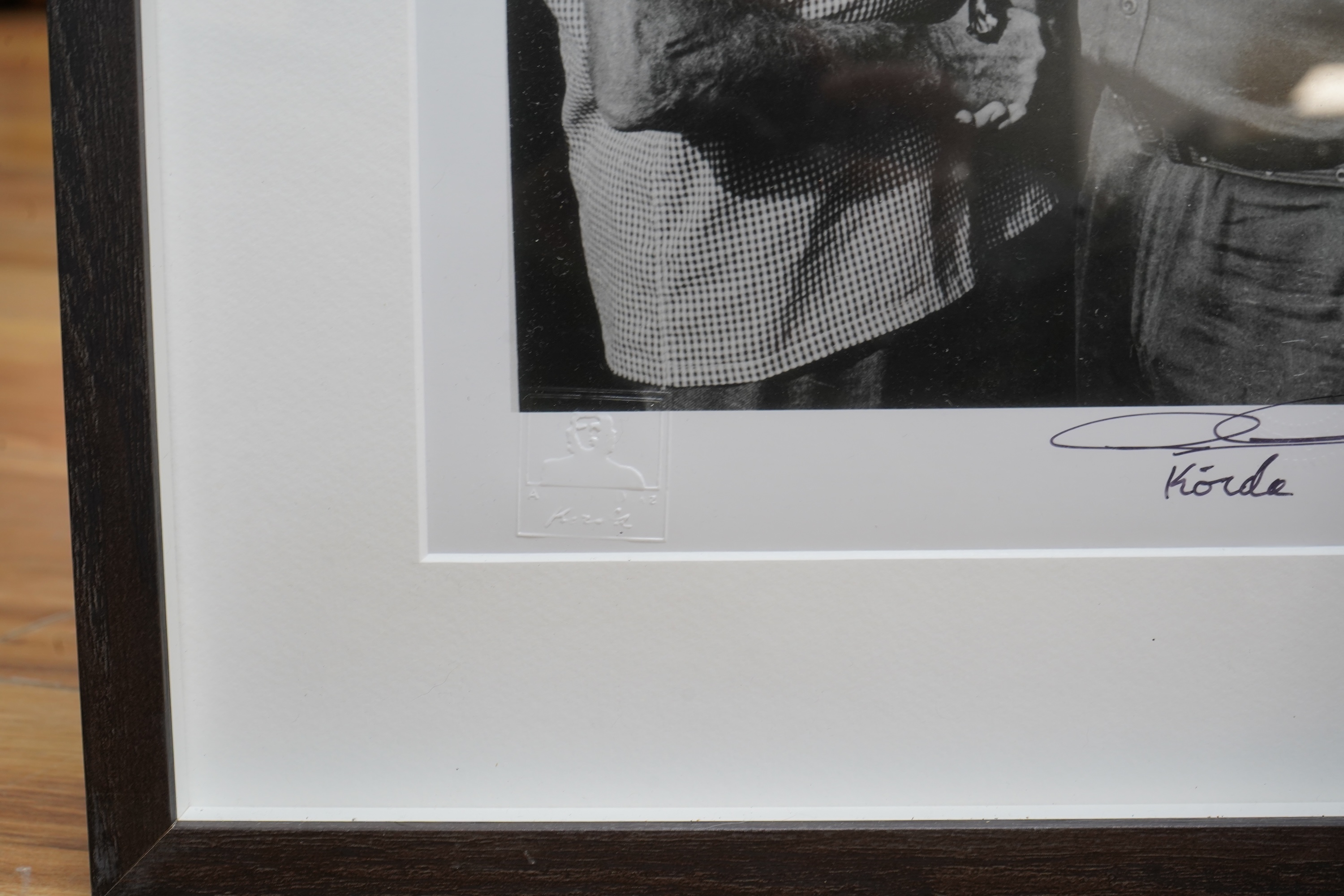 Alberto Korda (1928-2001), ‘Fidel Castro and Ernest Hemingway shaking hands’, stamped, signed in ink to the margin, with ADK blind stamp, gelatin silver print, 28 x 19cm